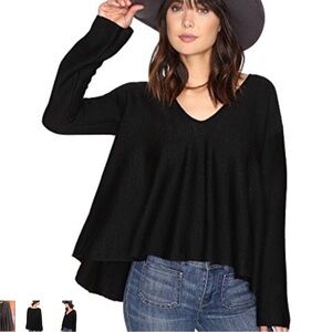 Free People black bell sleeve pull over sweater size small.